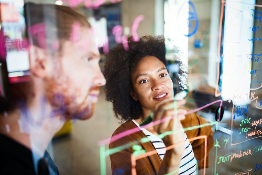 Businesspeople discussing together in conference room during meeting at office