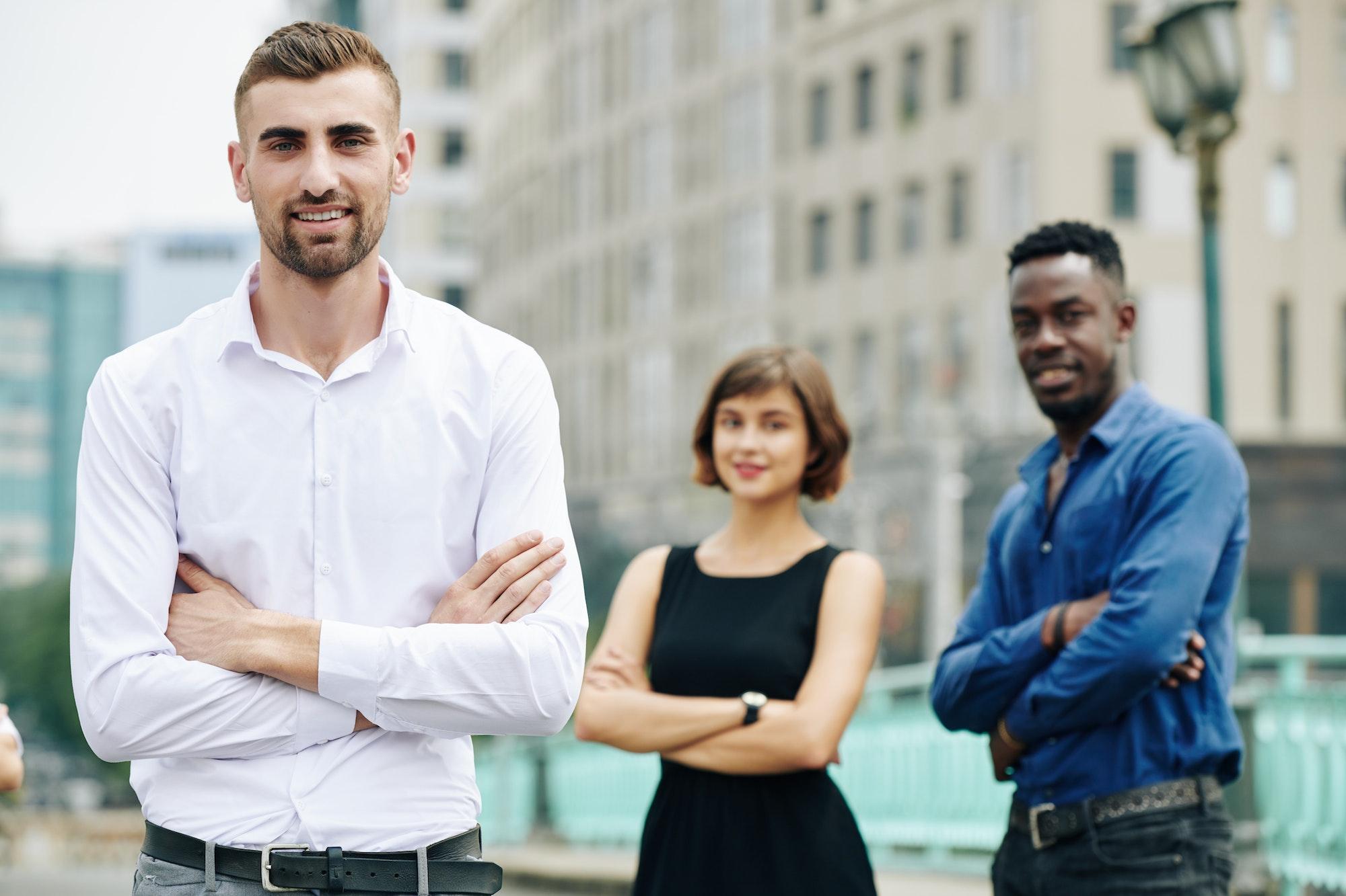 Positive confident young leader