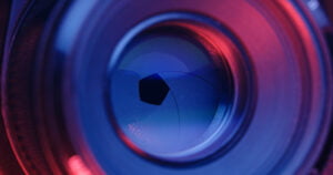 Adjusting Camera lens aperture with pink and purple light