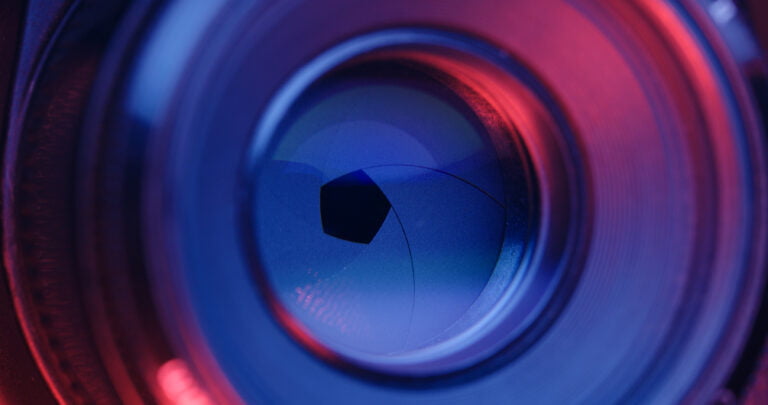 Adjusting Camera lens aperture with pink and purple light