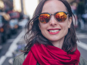 Smiling girl in sunglasses close-up