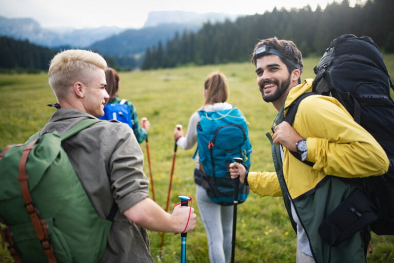 Hiking with friends is so fun. Group of young people with backpacks walking together